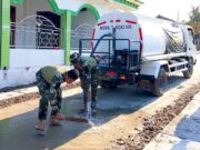 TMMD Bojonegoro, Satgas Siram Jalan Cor Demi Warga Tetap Nyaman IMG 20260810 WA0034