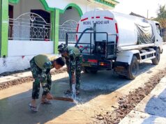TMMD Bojonegoro, Satgas Siram Jalan Cor Demi Warga Tetap Nyaman IMG 20260810 WA0034